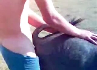 Dude pulls down his undies to fuck a sexy black dog outdoors here