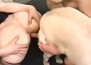 Sexy zoophile keeps her ass cheeks spread while fucking a white dog