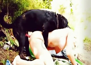 Alluring blondie with a pretty pussy gets fucked by a dog from behind